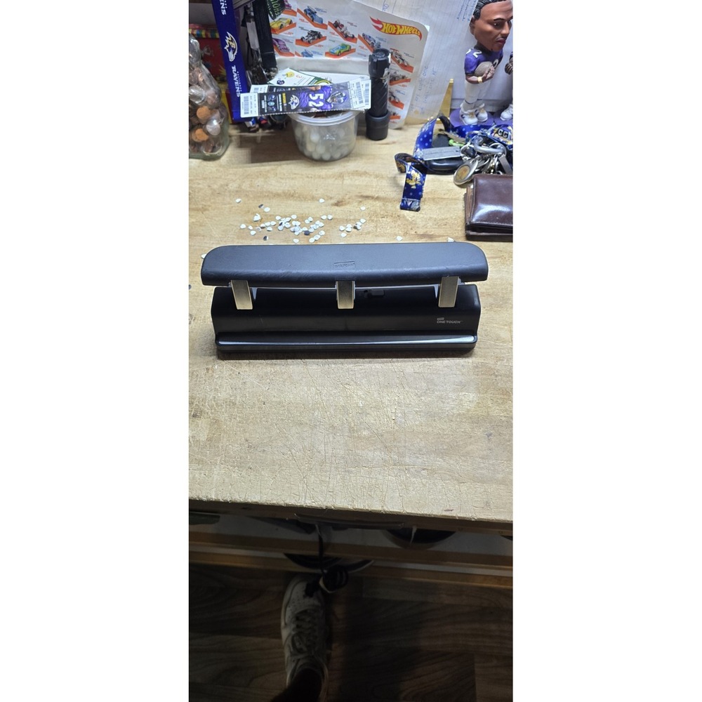 item is a Staples One-Touch 3-Hole Punch